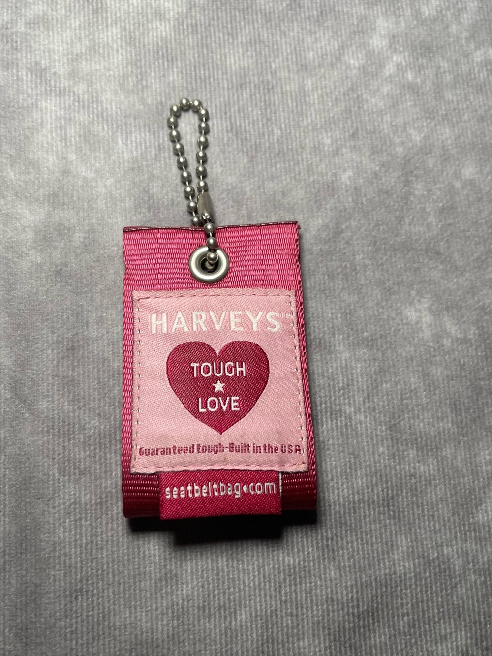 Harvey’s seatbelt brand hangtag pink tough love